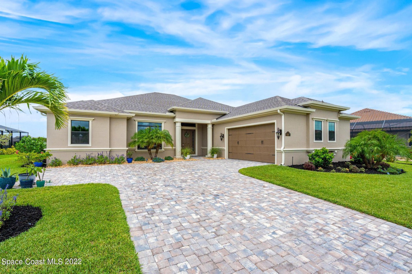 Front of the home with paver driveway