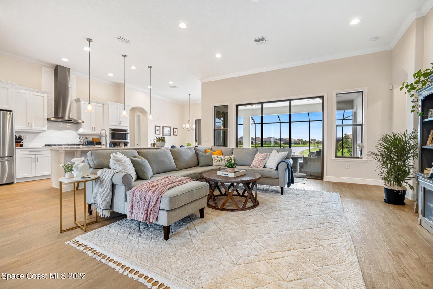 Living room with sliding doors to the pool and lake